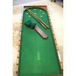 A 19th century mahogany folding table top bagatelle board, 84" x 26" when open