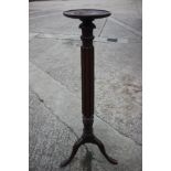 A mid 19th century carved mahogany torchere with shaped column and tripod splay support, 10" dia x