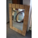 A modern carved oak framed wall mirror, plate 21 1/2" x 35 1/2"