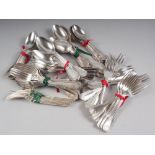 An assortment of silver plated cutlery, including fish knives, tablespoons, etc