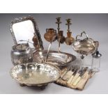 An assortment of silver plate, including a biscuit barrel, 6 1/2" high, a pair of brass candlesticks