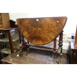 A Victorian burr walnut and inlaid oval Sutherland tea table, on spiral turned and scroll splay