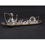 A miniature four-piece silver teaset, on tray, 2oz troy approx