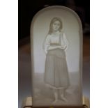 A pair of late 19th century arch top lithophane panels, decorated women, stamped "HPM", 6 1/2" x 3",