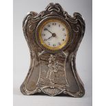 An Art Nouveau silver fronted clock with later added quartz movement, 6" high, and a Swiza gilt
