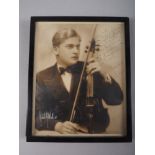 A signed and dedicated photograph, Yehudi Menuhin, 10 3/4" x 8 1/2", in ebonised frame