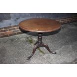 A 19th century mahogany circular tilt top table, on turned column and tripod splay support, 28"