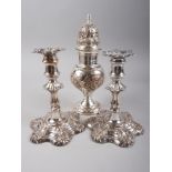 A pair of Sheffield silver plated candlesticks and a similar sugar sifter