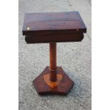 A 19th century mahogany, rosewood and banded fold-over top games table, on turned column triform