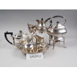 A quantity of silver plate, including a teapot, on stand, another similar teapot and an assortment