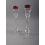 A pair of Waterford candlesticks, on circular bases, 8" high