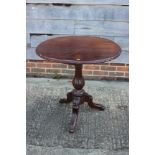 A 19th century mahogany circular top occasional table, on turned and carved column and tripod