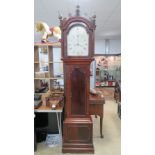 An eight-day striking long case clock.