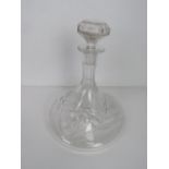 A cut glass ships style decanter, with stopper.