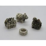 Three 925 silver charms including a cow marked Cham 925, together with another bead - unmarked.
