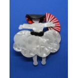 An overlaid plastic brooch in the style of Lea Stein in the form of a lady with fan and hat,