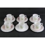 A set of five Susie Cooper trios each in Orchid design with white and blush pink ground,