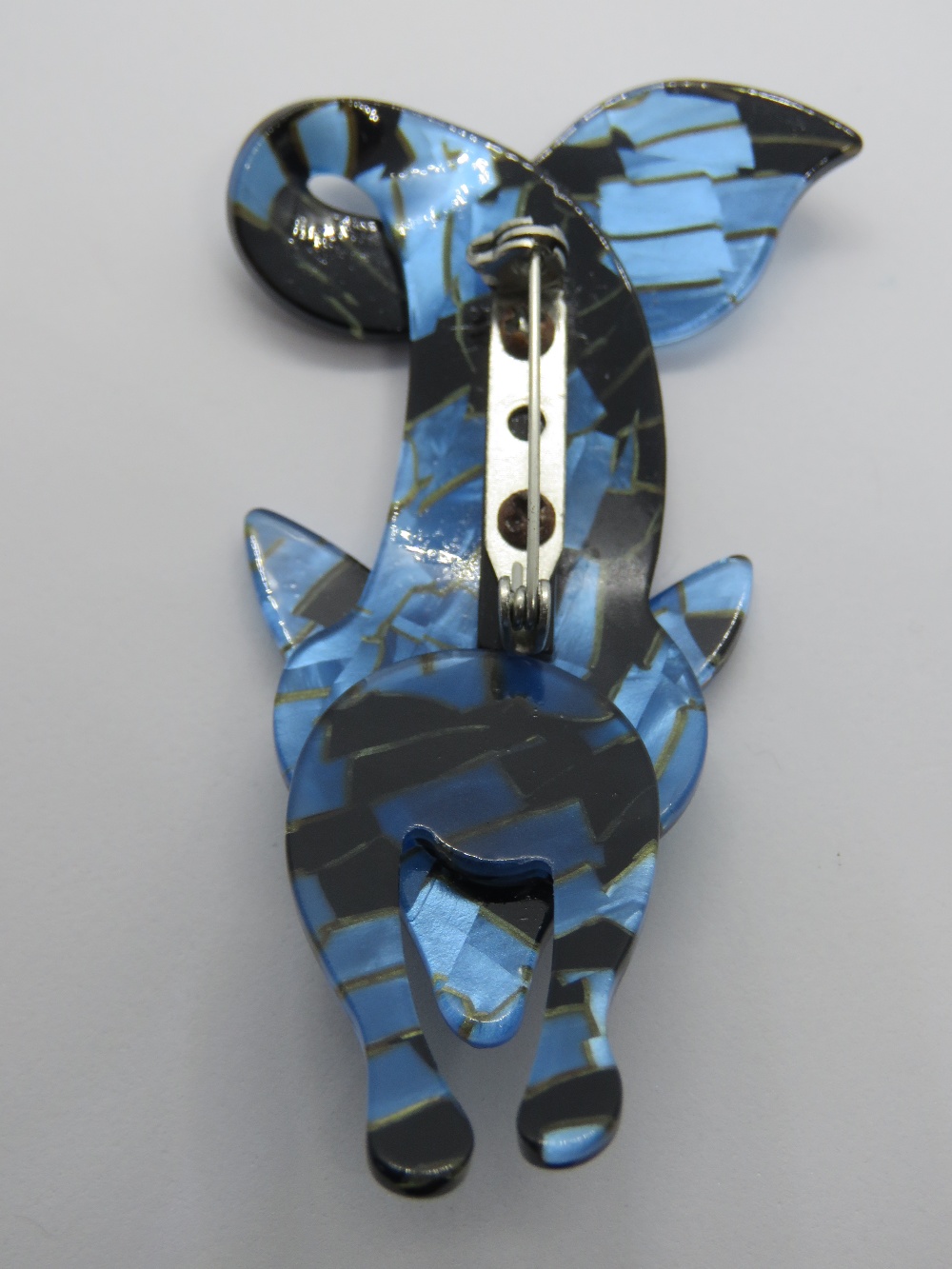 An overlaid plastic brooch in the style of Lea Stein in the form of a fox, 7.5cm in length. - Image 2 of 2