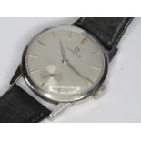 A vintage Omega wristwatch having silvered dial with subsidiary seconds dial, yellow metal hands,