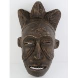 An African carved wooden wall mask, 36cm high.