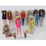 Two horse riding Barbies with jointed legs together with a long haired Barbie,