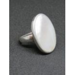 A silver and mother of pearl ring, stamped 925, size O-P, 2.9 x 2.3cm.