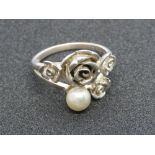 A silver Folli Follie ring having floral design with single pearl, stamped Folli Follie with 925,