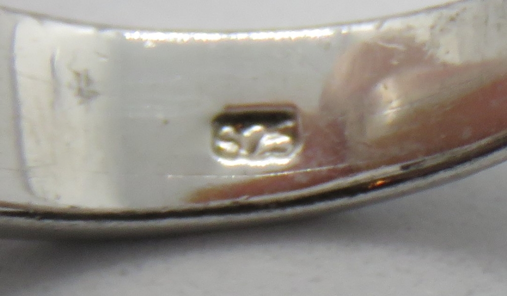 A silver and opal ring with Greek key design carved panels, stamped 925, size O-P. - Image 2 of 2