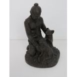 A heredites bronzed figurine of a shepherd and dog.