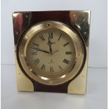 A Citizen mantle clock having brass fittings and Quartz movement, standing 13cm high.