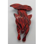 An overlaid plastic brooch in the style of Lea Stein in the form of a fox, 7.5cm in length.