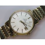 A vintage Omega Automatic gold plated wristwatch having silvered dial with date aperture,