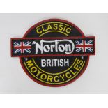 A contemporary cast metal Norton sign.