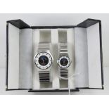 A 'His and Hers' stainless steel gents wristwatch and ladies wristwatch set, in presentation box.