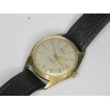 A vintage Oris wristwatch, gold plated with silvered dial, on black leather strap.