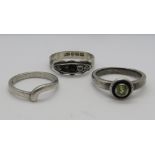 Three silver rings; one hallmarked silver set with five stones, size Q,