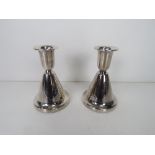 A pair of silver Chrisophersen short candlesticks,