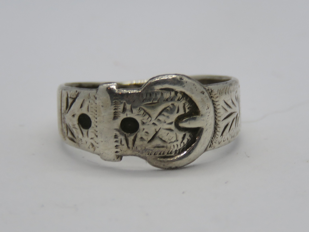 A silver ring in the form of a belt and buckle, hallmarked for Birmingham, size M.