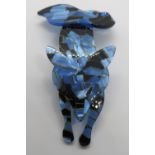 An overlaid plastic brooch in the style of Lea Stein in the form of a fox, 7.5cm in length.