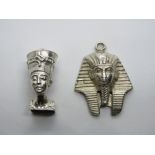 A silver charm in the form of Nefertiti Egyptian Queen and another white metal charm or pendant in