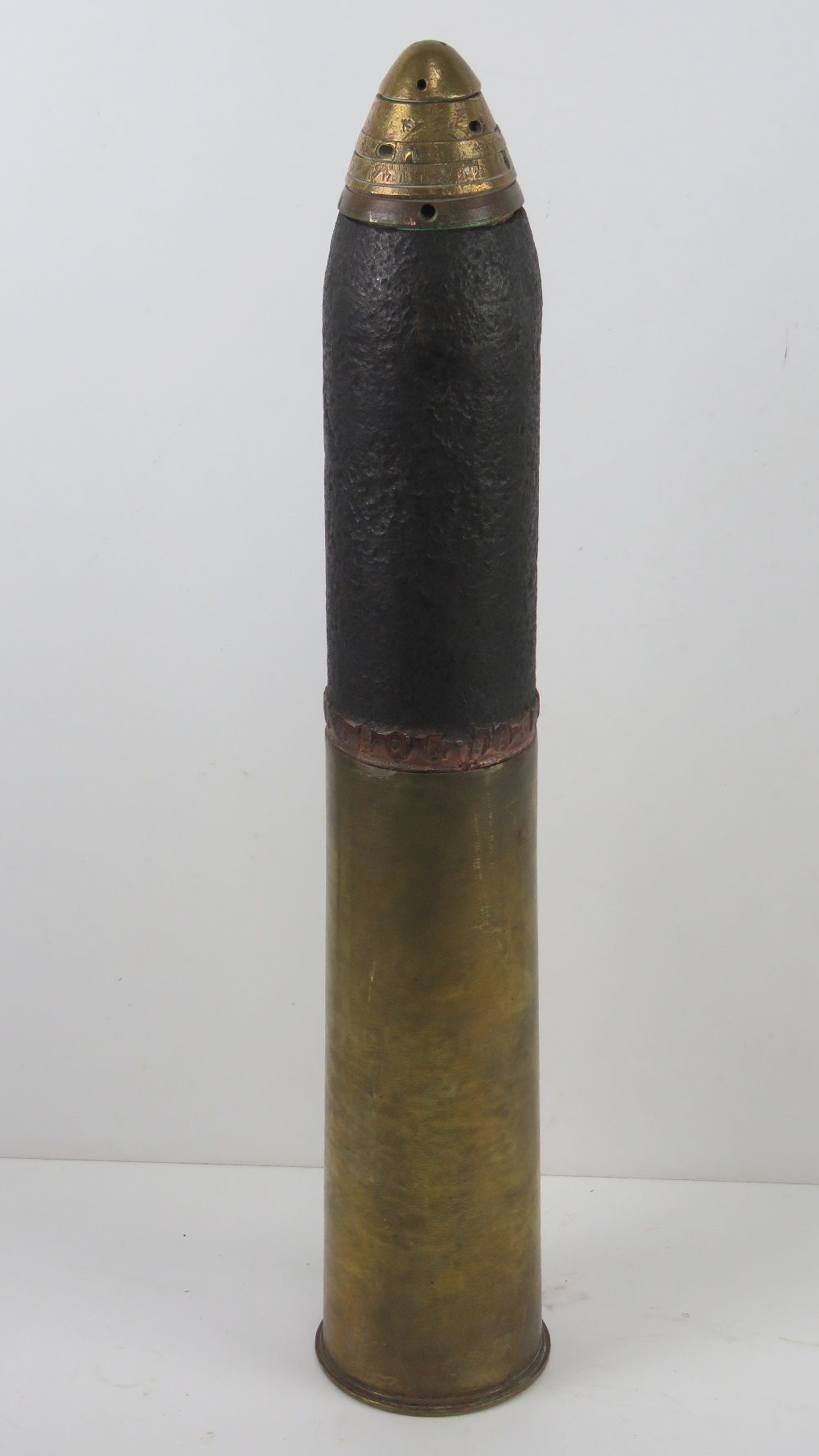 An inert WWI 18lb artillery shell, dated 1918 and marked, measuring 58cm high.