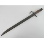 A WWII Japanese Arisaka bayonet with scabbard.