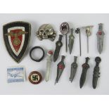 A quantity of assorted re enactor's German badges inc miniature swords, reproduction day badge,