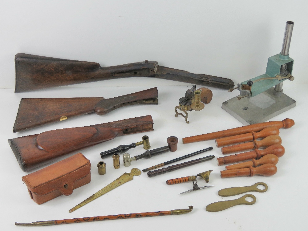 A quantity of assorted militaria items inc, rifle stocks, loader press, gauge kits, ammo case,