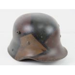 A reproduction WWII German helmet with liner and chin strap.