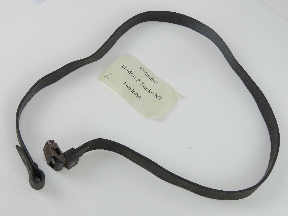 A WWII German MP40 black leather sling, made by Linden & Funke KG Iserlohn.