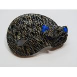An overlaid plastic brooch in the style of Lea Stein in the form of a sleeping cat, 6cm wide.