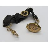 A Georgian gentlemans fob on waistcoat hanger, gilt metal fittings, fob engraved SCP.