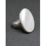 A silver and mother of pearl ring, stamp