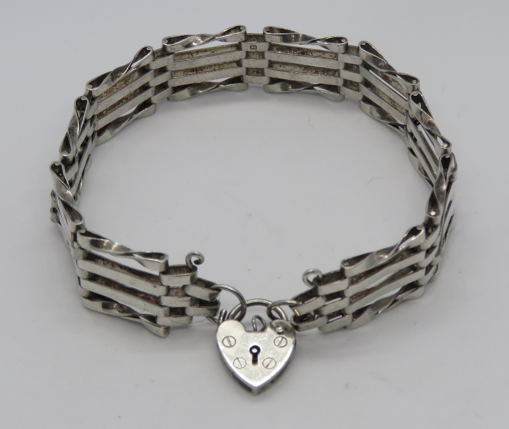 A silver four bar bracelet having hallma